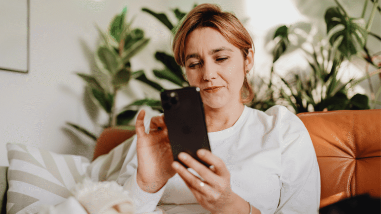 Woman comparing insurance rates on her phone